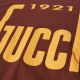 Gucci '1921 Gucci' Logo T-Shirt in Brown